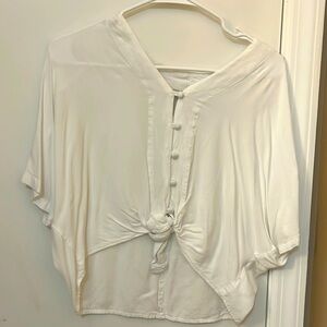 White loose fitted shirt that is tied at the bottom